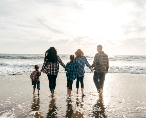 Family On Beach Spending Time Together