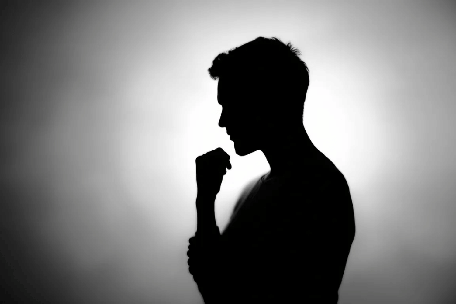 The image features a silhouette of a person in a contemplative pose symbolizing self reflection and the recognition of trauma patterns particularly related to generational trauma